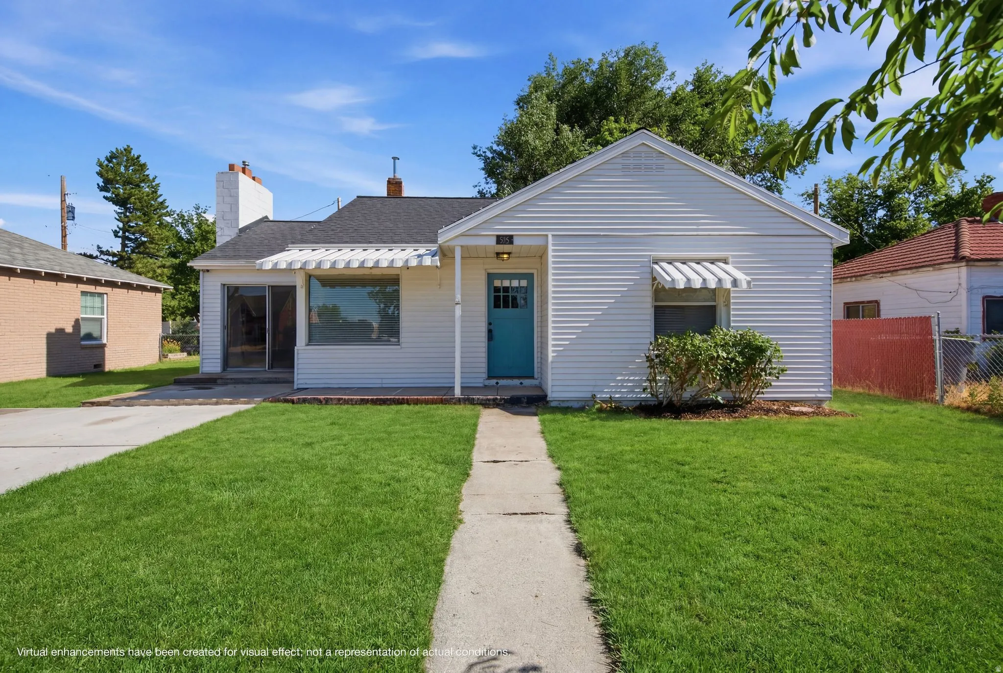 White siding exterior with a contrasting teal entry door, complemented by a covered front porch and a paved walkway