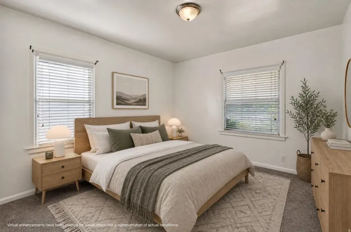 Neutral wall paint and textured carpet flooring define this room