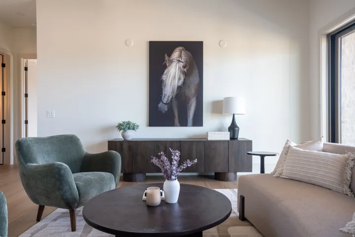 Hardwood-style flooring and a dark wood-finish console table