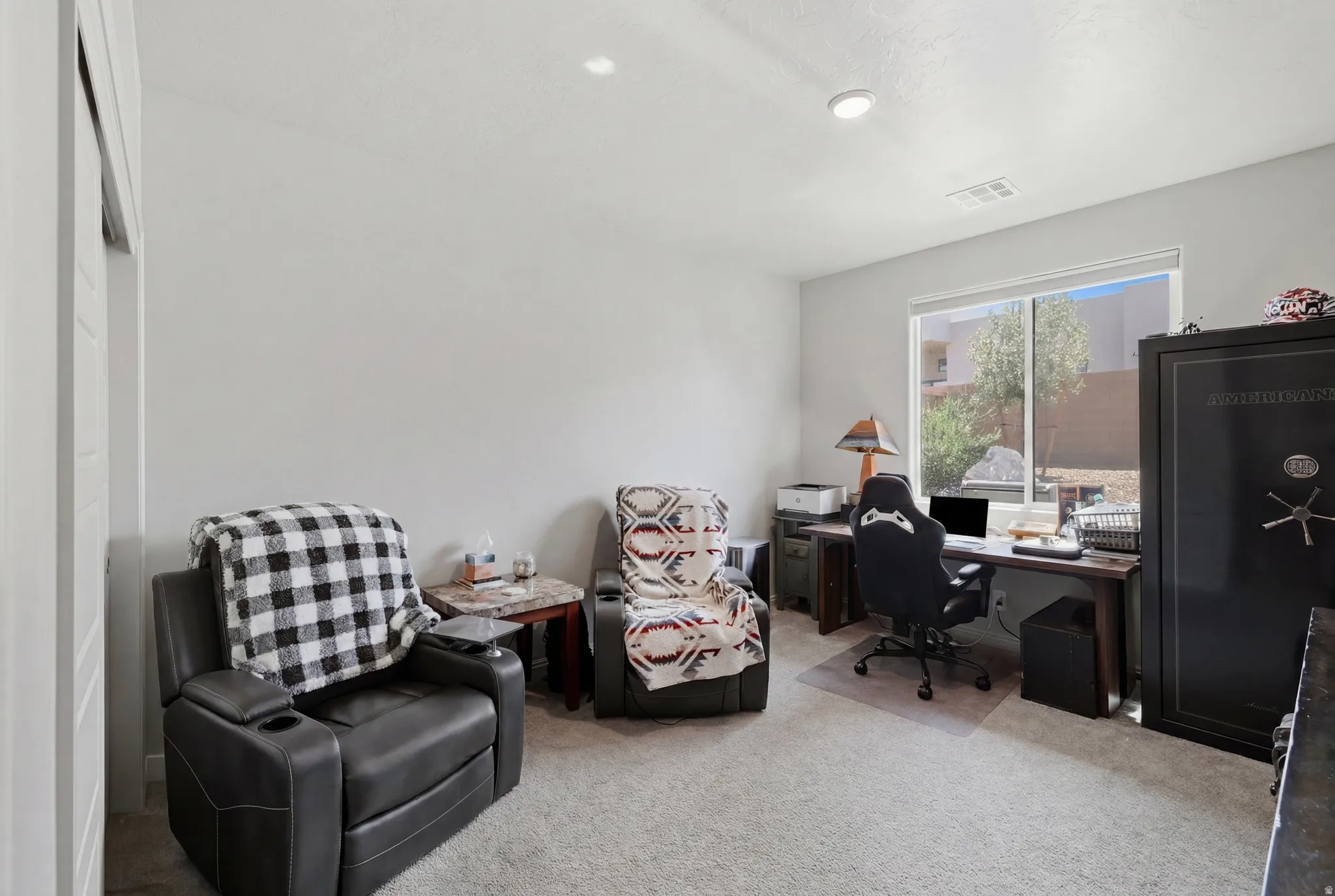 Room featuring carpeted flooring and white walls