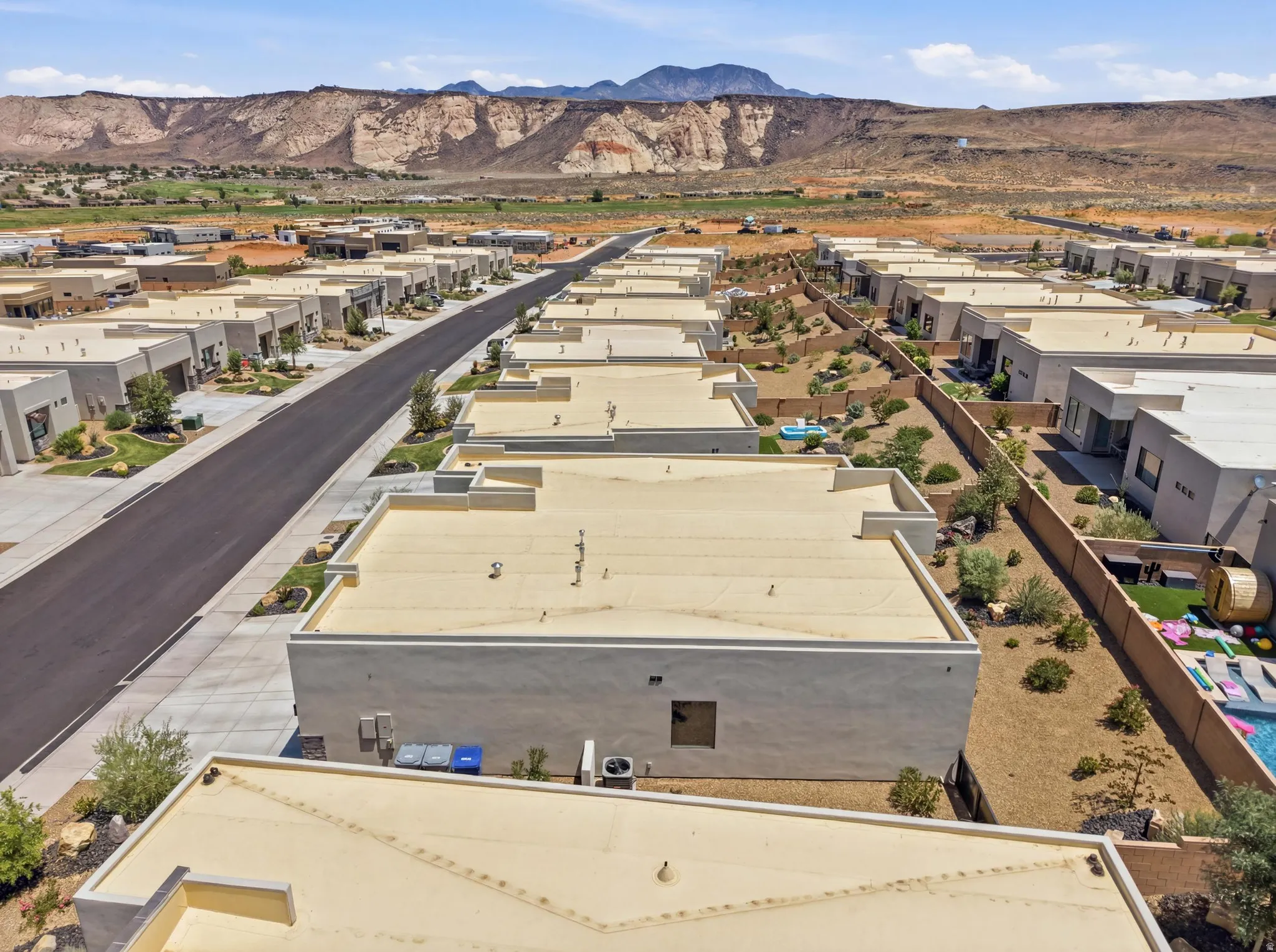 Modern residential development featuring stucco exteriors and flat roofs