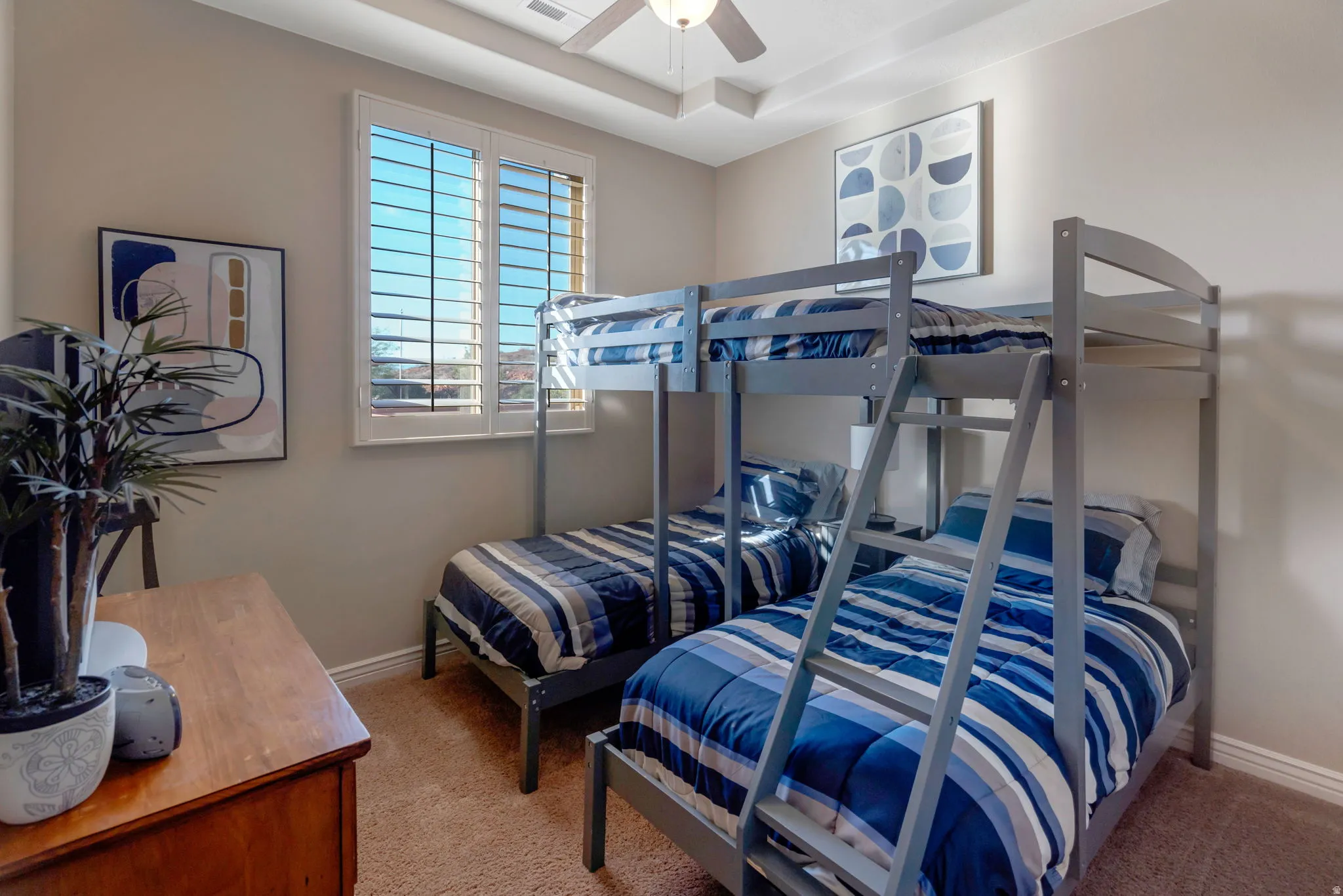 Room featuring neutral wall paint, white trim, and light brown carpet