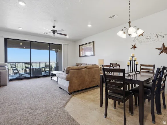 Open-concept living and dining area featuring a sliding glass door to an outdoor patio