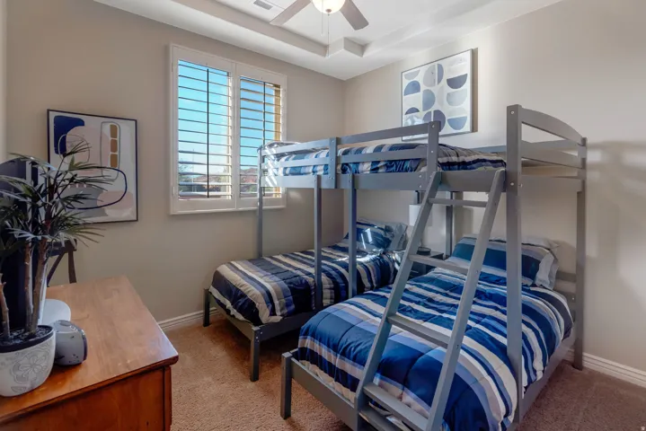 Room featuring neutral wall paint, white trim, and light brown carpet