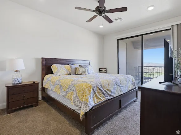 Bedroom featuring a sliding glass door to an exterior balcony
