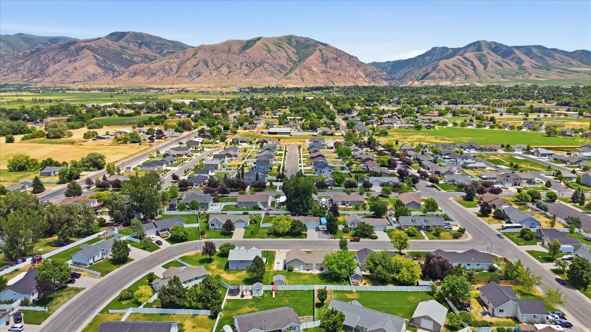 Aerial perspective showcasing a residential community with paved streets and established landscaping