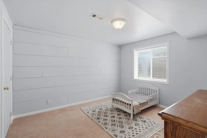 Accent wall featuring horizontal shiplap paneling