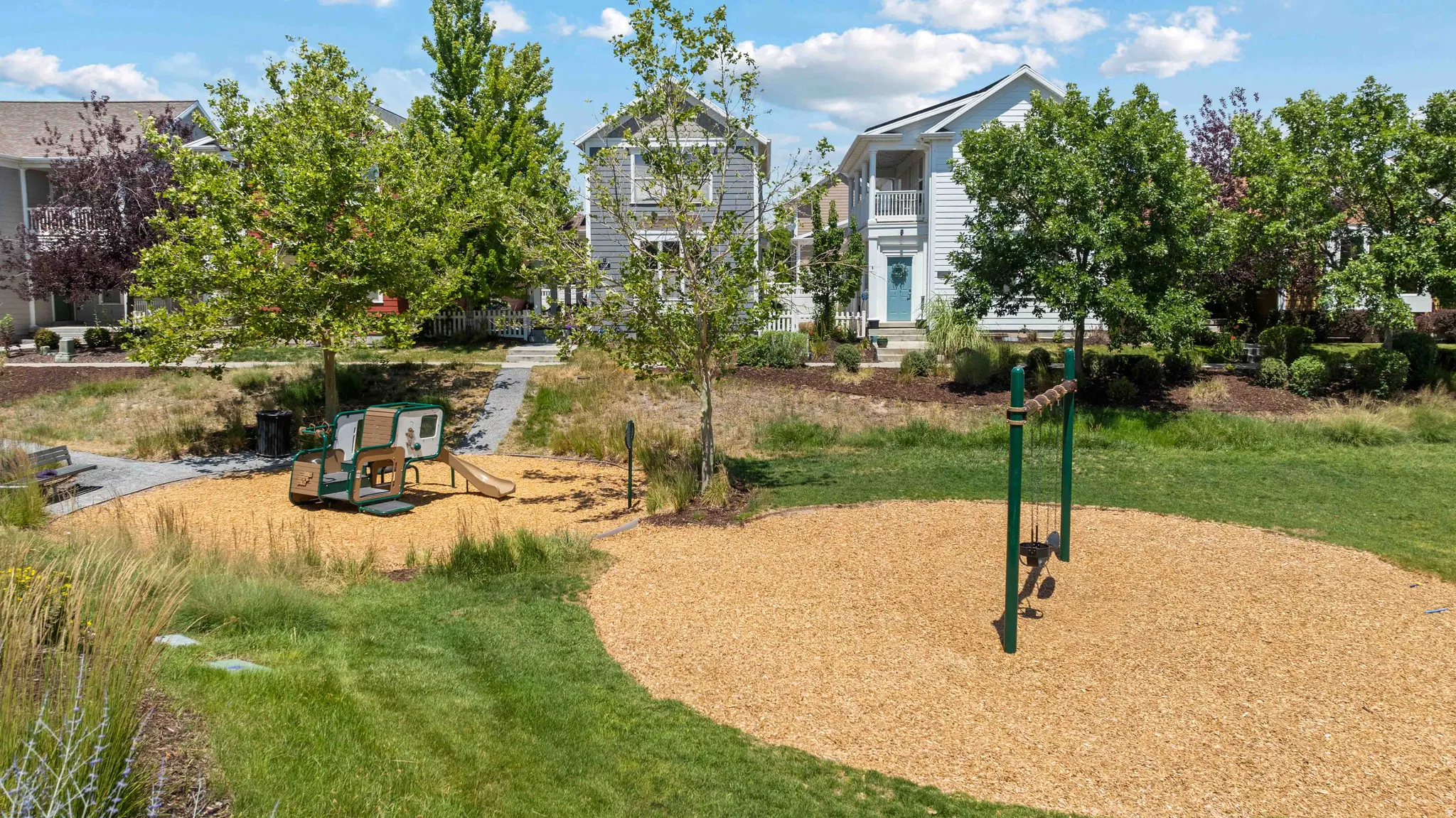 Peak-a-boo park is the closest park to the condo featuring a wood chip play area, swings, and playground equipment