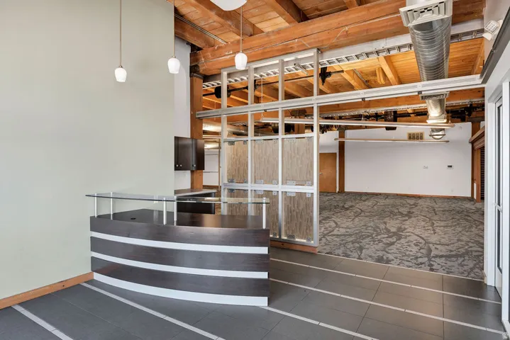 Contemporary reception desk with a curved design and glass counter
