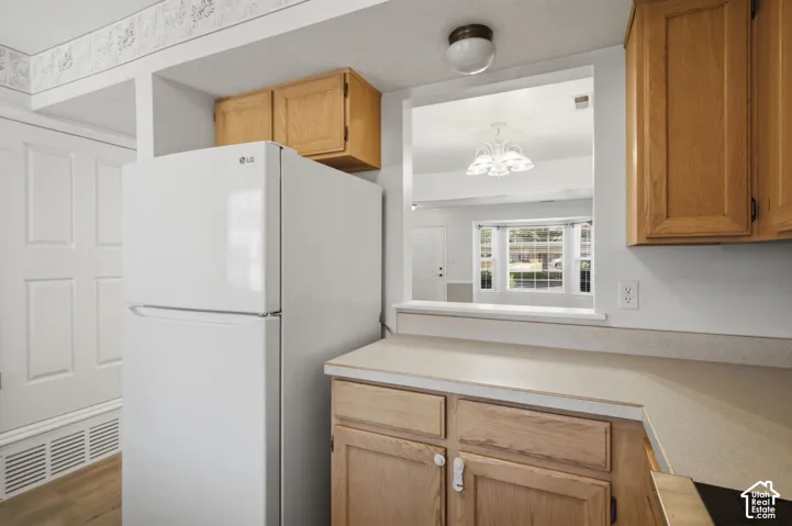 Kitchen pass-through window opening to an adjacent room