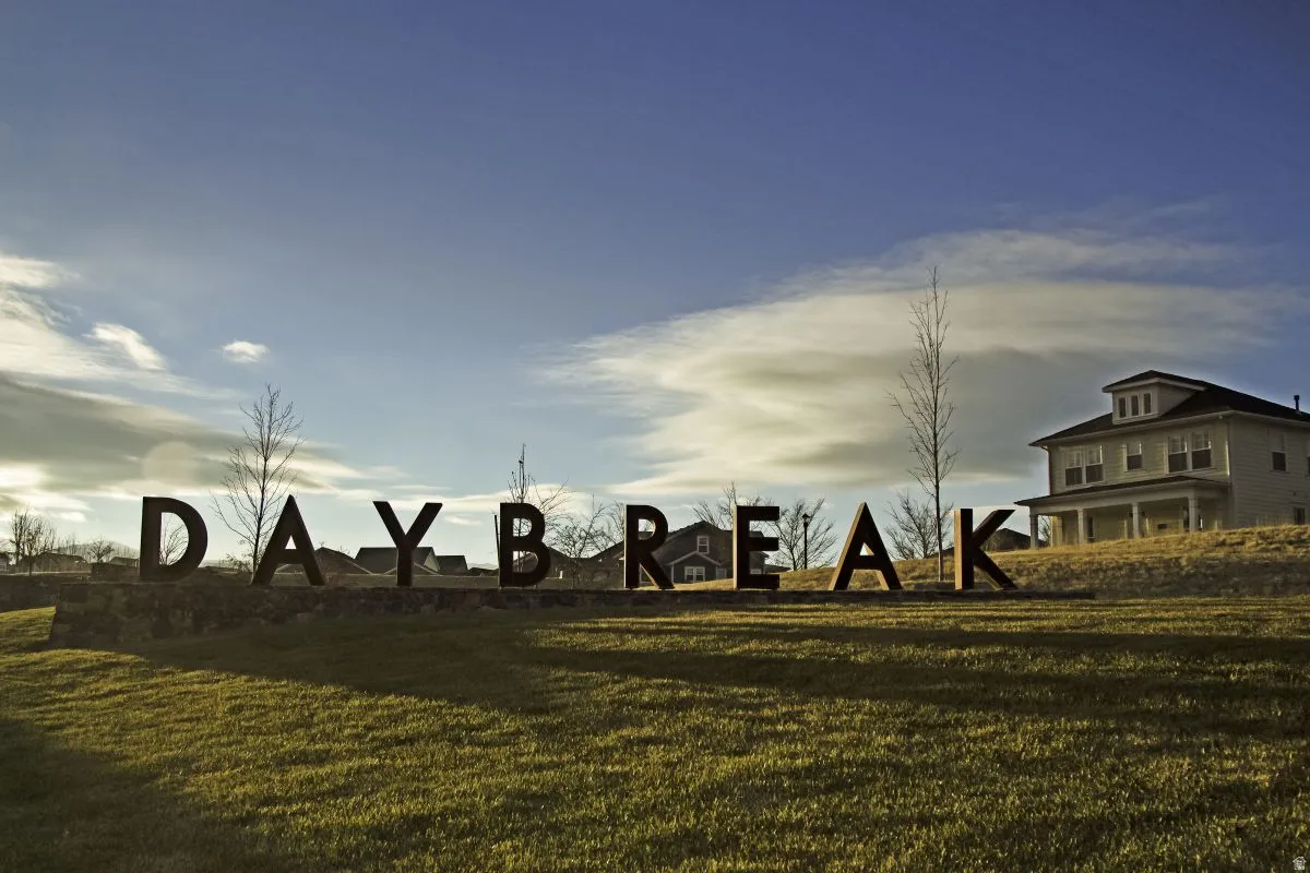 Custom "Daybreak" signage set within a landscaped grass area