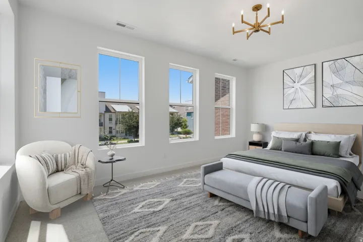 Spacious room featuring multiple windows, recessed lighting, and a modern chandelier
