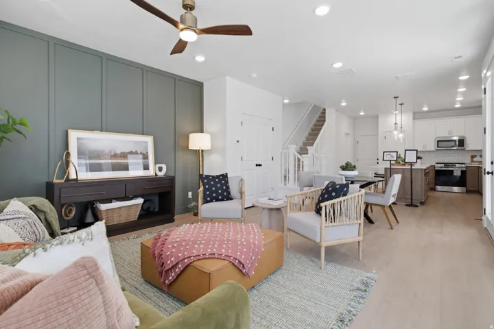 Open-concept living space featuring wood-finish flooring and recessed lighting