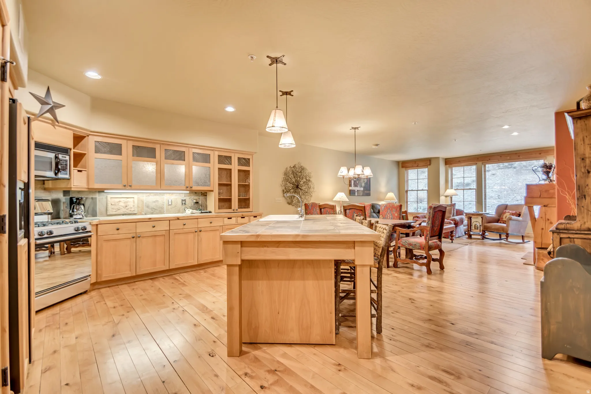 Open-concept living area featuring light wood-finish flooring throughout