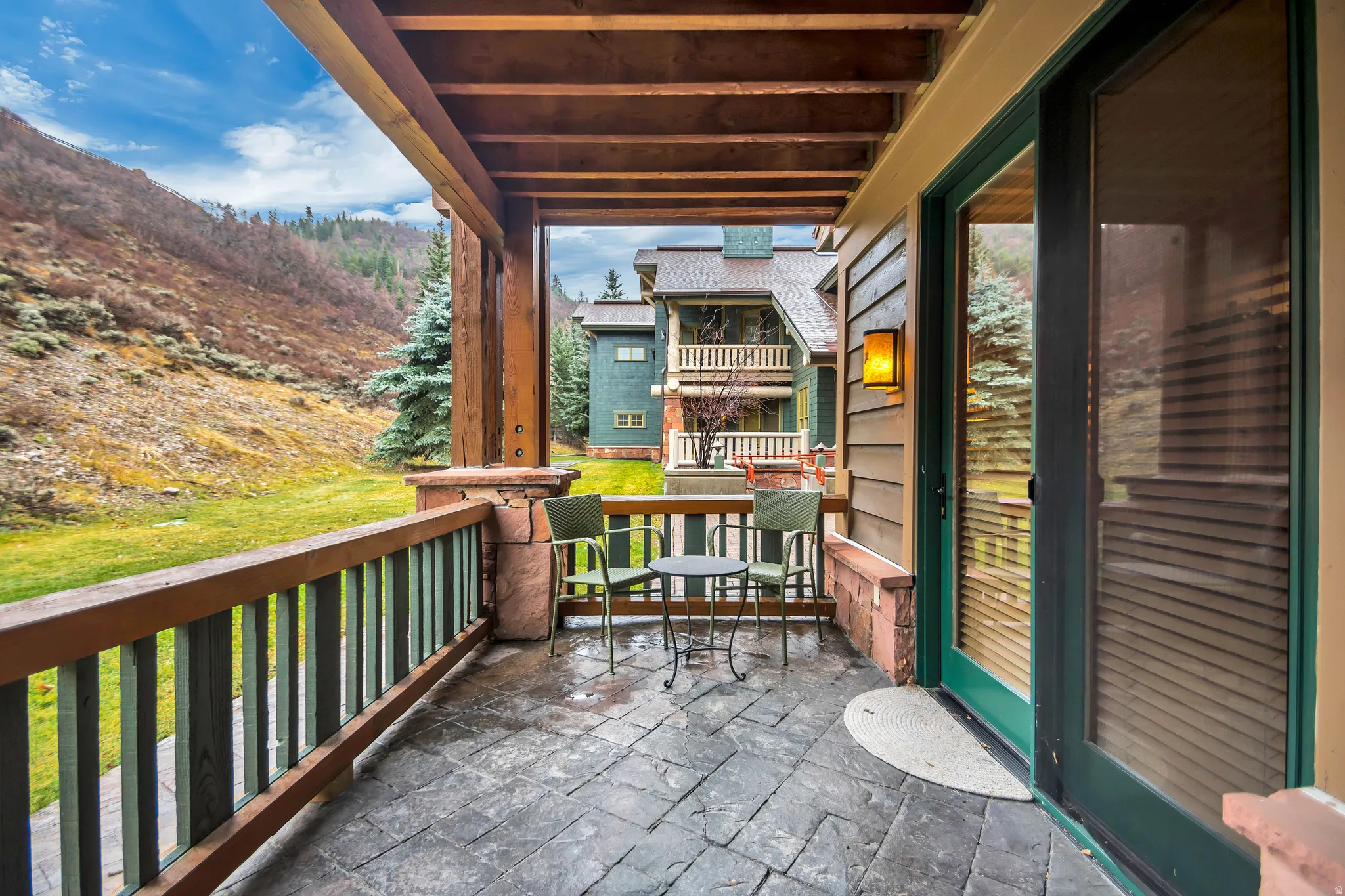Covered patio featuring stamped concrete flooring