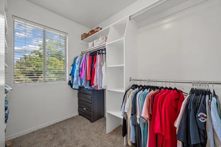 Walk-in closet in primary closet
