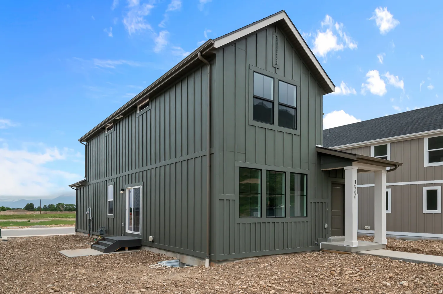 Contemporary two-story exterior with vertical board and batten siding
