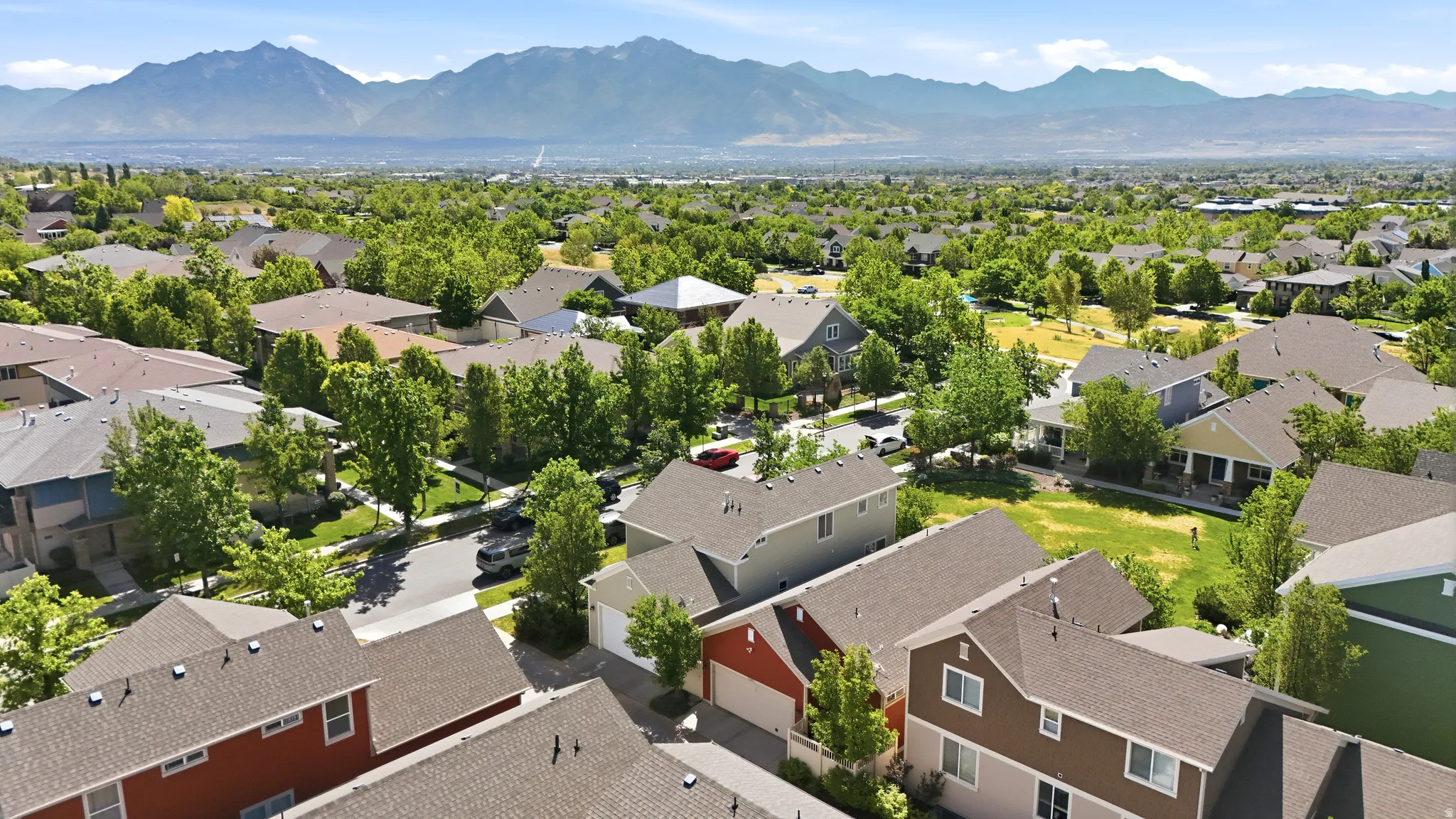 Expansive residential neighborhood featuring numerous detached properties with pitched roofs