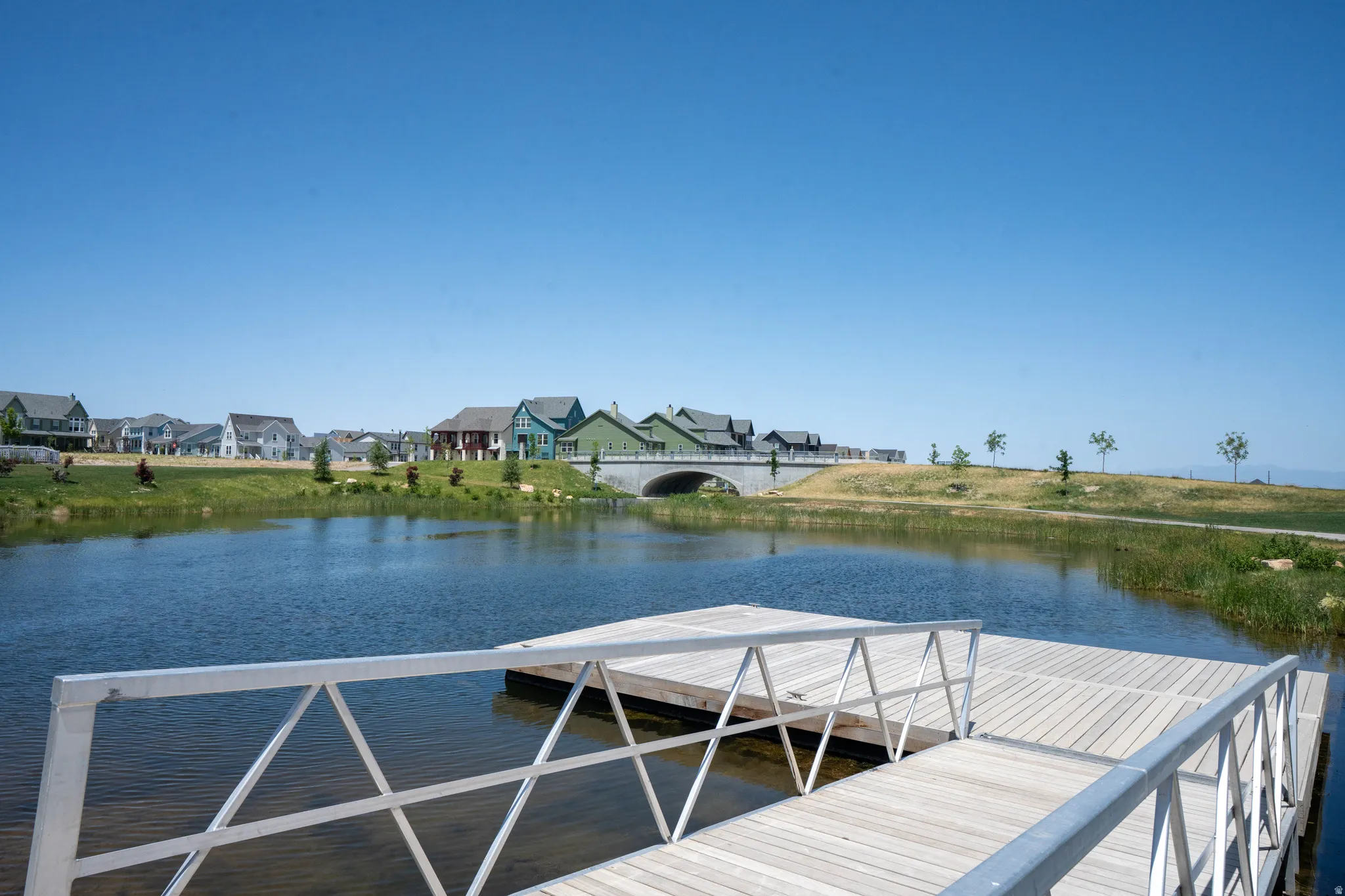 Floating dock with aluminum railings and wood-finish decking