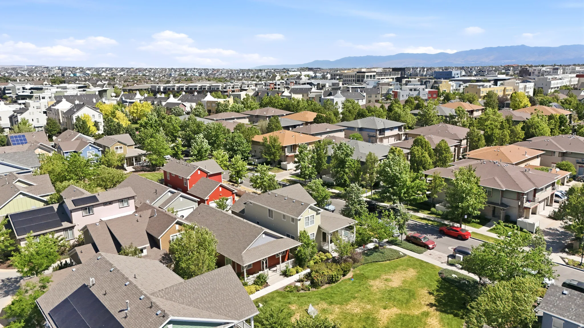 Residential neighborhood featuring varied architectural styles and mature landscaping