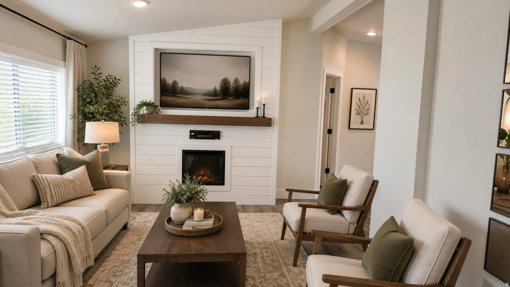 Virtually Staged Photo. Living area featuring a shiplap fireplace surround, wood mantel, and built-in electric fireplace