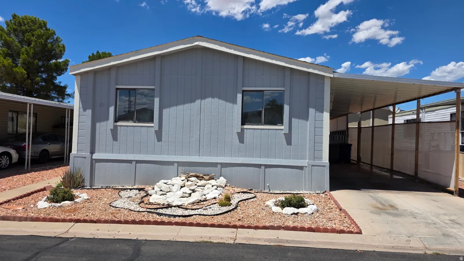 Light blue exterior siding with white trim