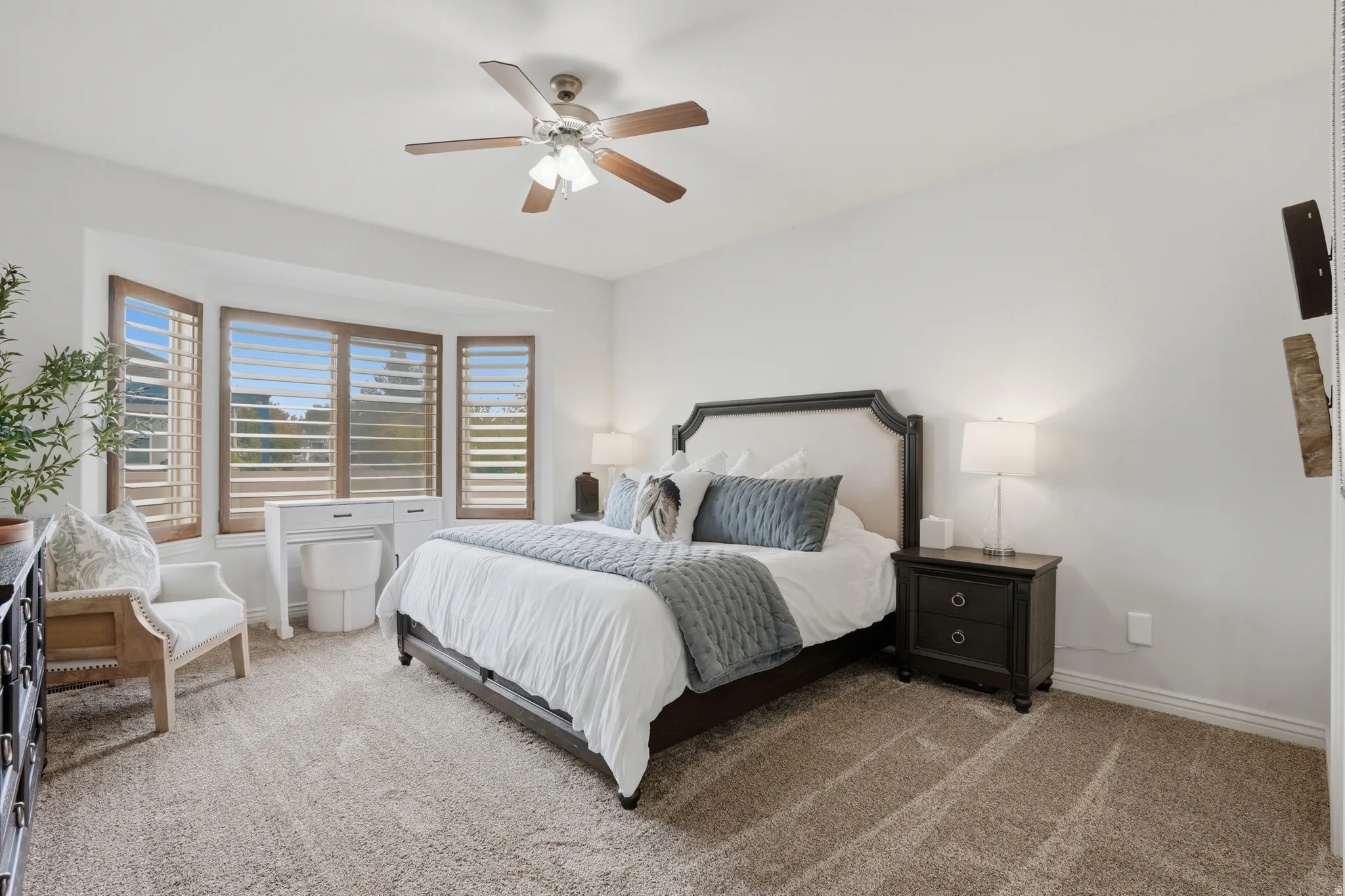 Spacious Master bedroom with bay window with wood plantation shutters