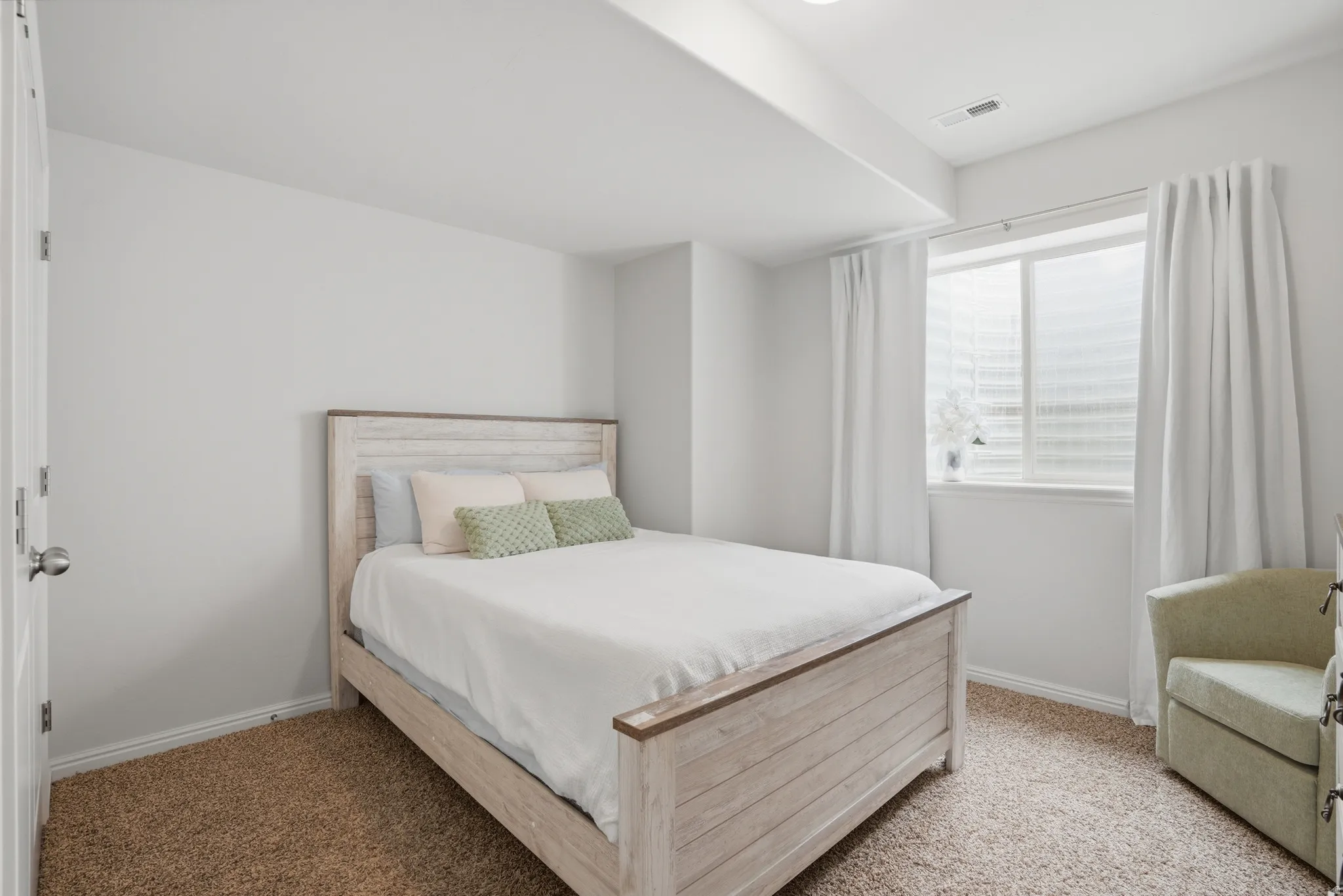 Bedroom featuring neutral wall colors, recessed lighting, a window with blinds and drapes, and plush carpet flooring