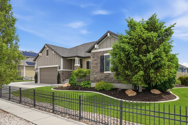 Craftsman-style home featuring a stone and board-and-batten exterior
