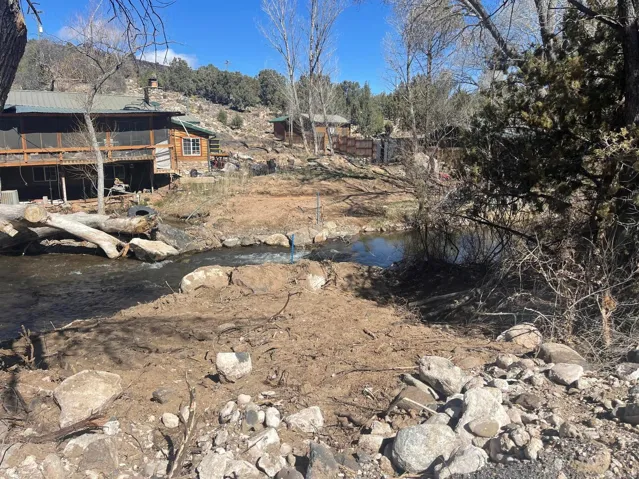 Water feature with natural rock banks