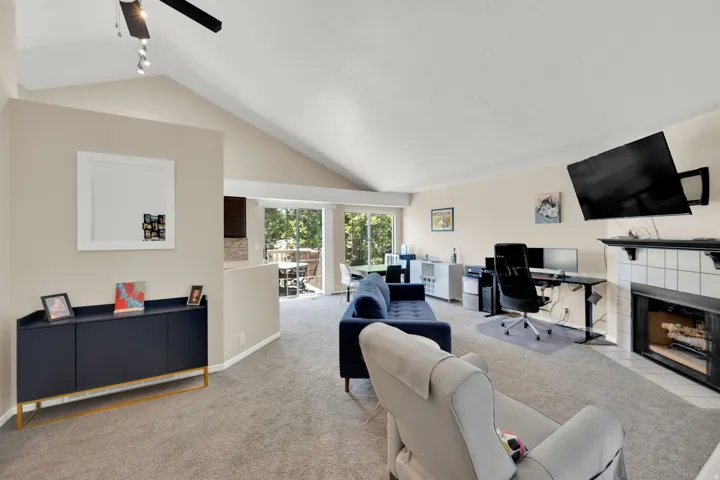 Living area with vaulted ceilings and recessed lighting