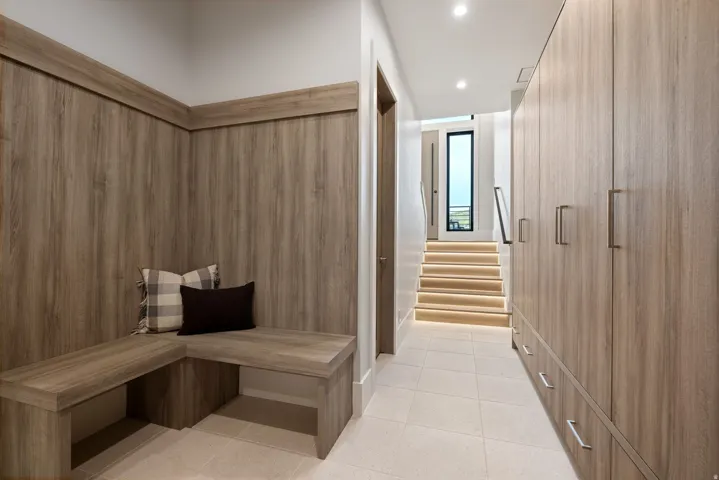 Built-in wood-finish bench seating with integrated wall paneling