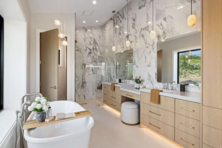 Freestanding soaking tub with floor-mounted faucet