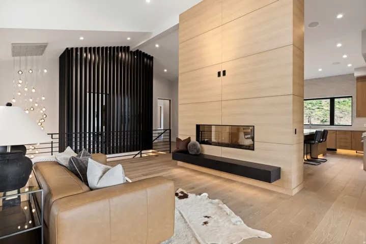 Open-concept living space with light wood-finish flooring