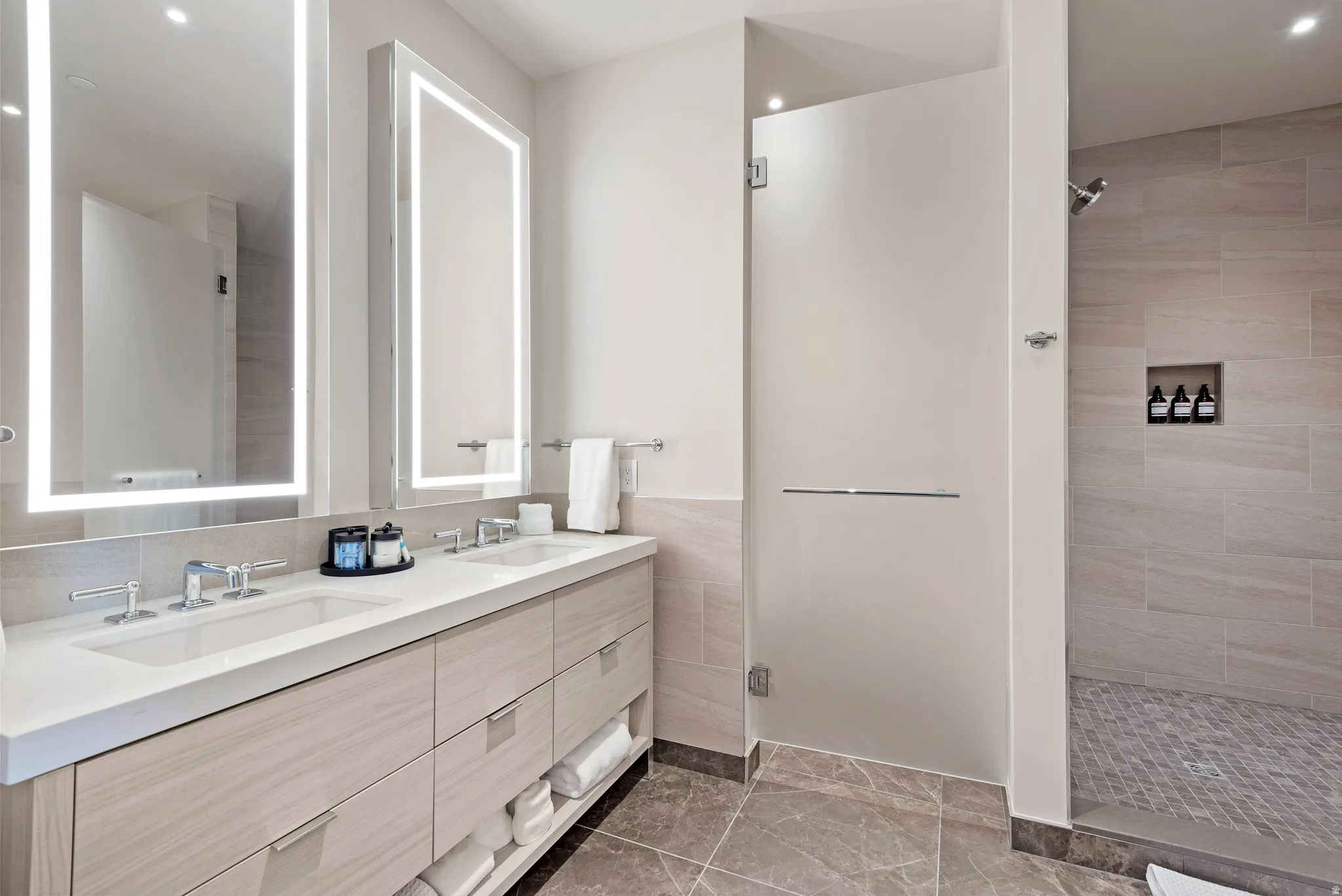 Double vanity with undermount sinks, quartz countertop, and chrome fixtures
