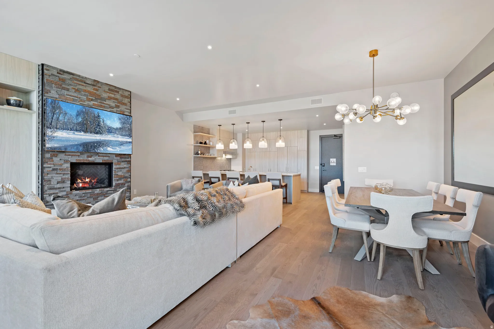 Open-concept living space featuring wood-finish flooring