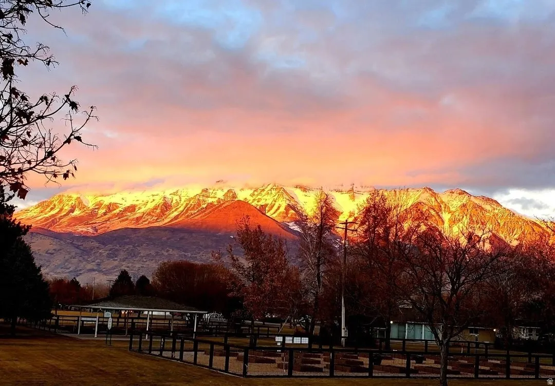 Distant snow-capped mountains under a vibrant sky