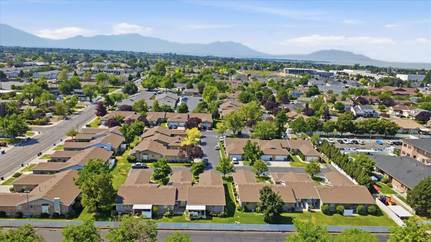 Residential community with established landscaping and mountain backdrop