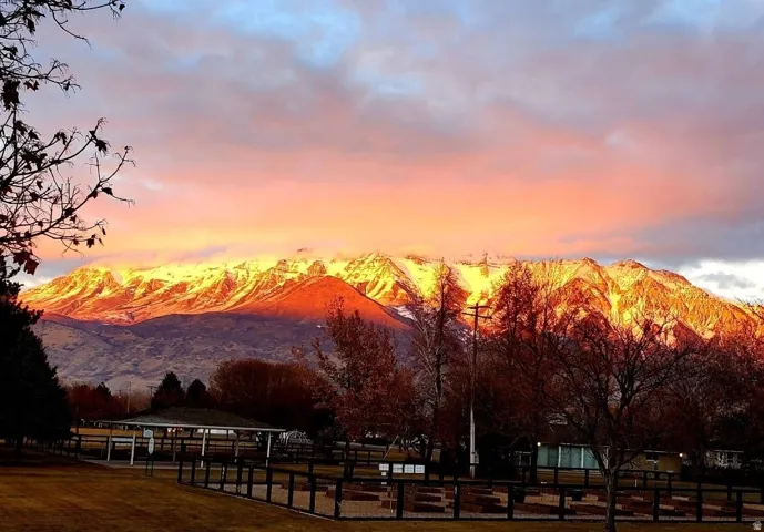 Distant snow-capped mountains under a vibrant sky