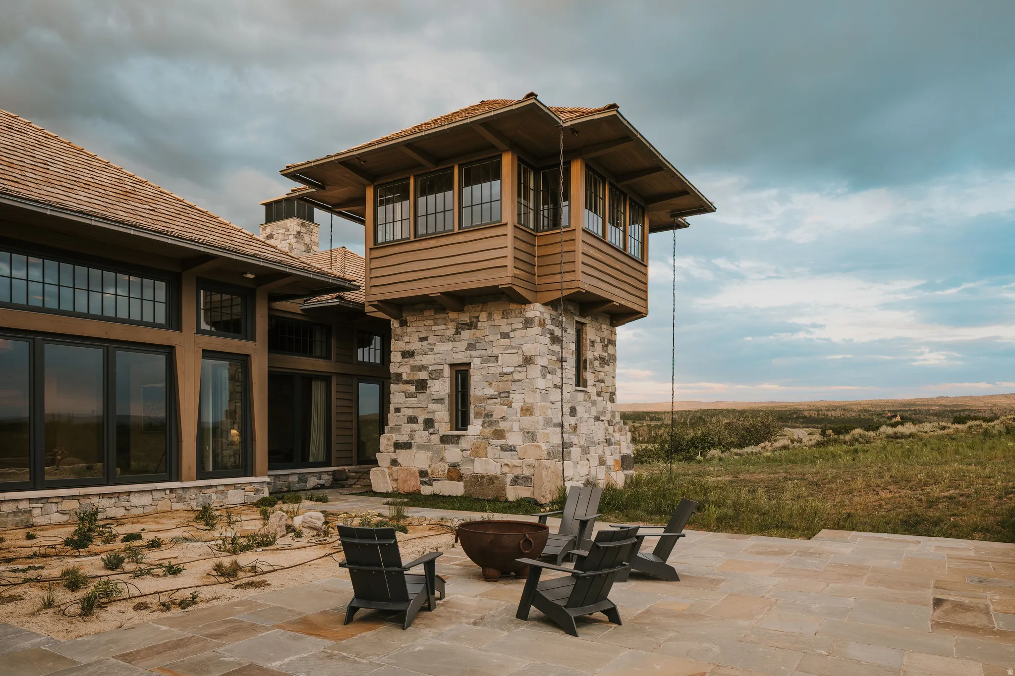 Craftsman-style home featuring extensive stone and wood siding