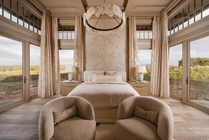 Bedroom featuring wood-finish flooring, full-height glass doors, and clerestory windows