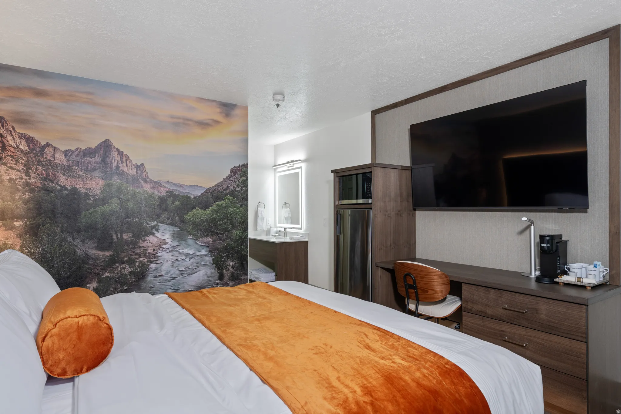 Accent wall featuring a scenic mural