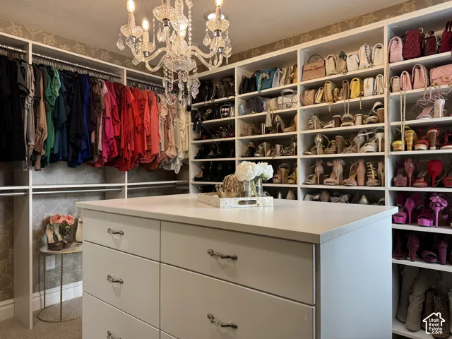 Custom closet system featuring extensive shelving and hanging storage