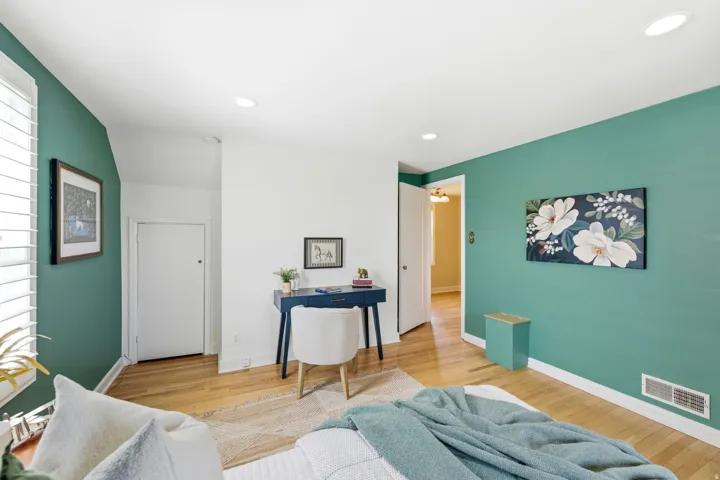 Interior room featuring recessed lighting and wood-finish flooring