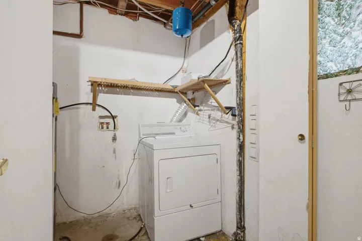 Laundry area with a white washer and dryer unit