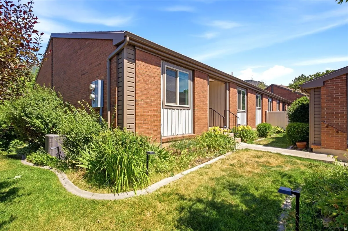 Brick exterior with brown trim and roofing