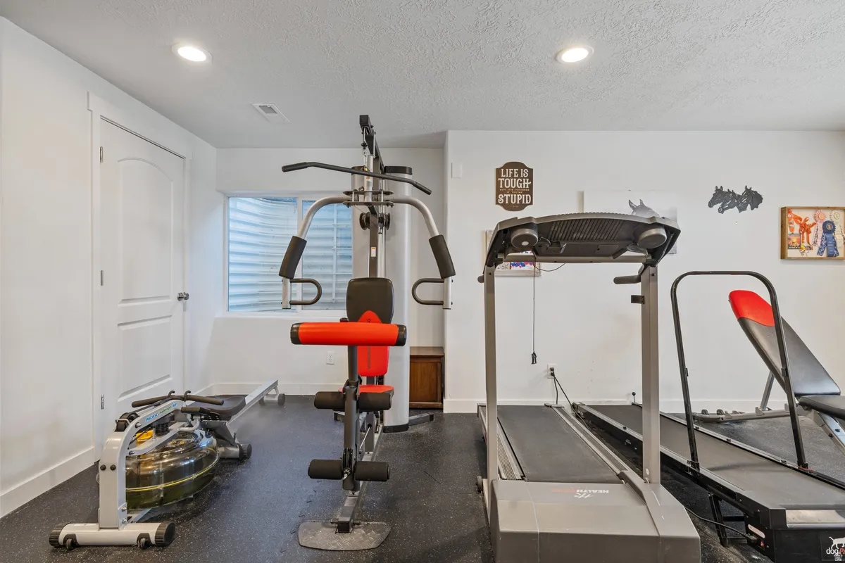 Dedicated room featuring recessed lighting and a window with blinds