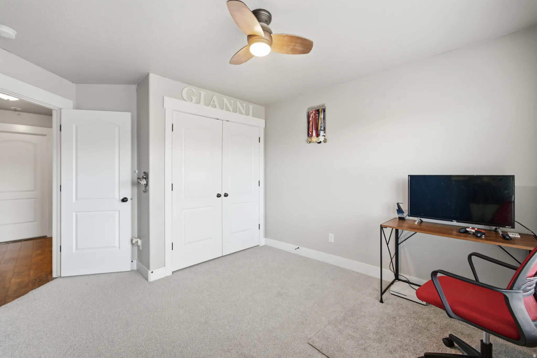 Recessed lighting, ceiling fan with integrated light, two-panel interior doors, and carpet flooring