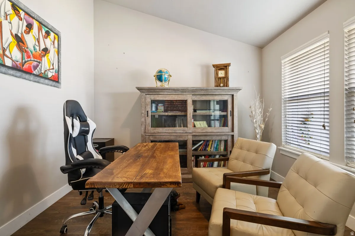 Warm wood-finish flooring complements the neutral wall tones