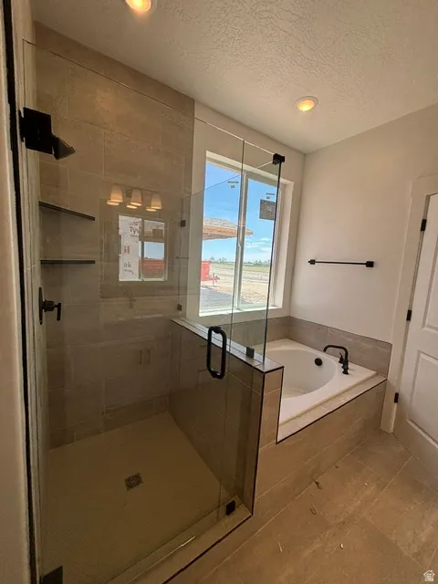 PRIMARY SUITE INCLUDES TILED  SEPARATE GARDEN TUB & SHOWER!